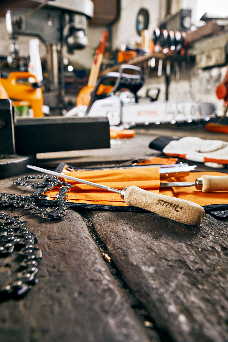 STIHL saw chain files and chainsaw chain on a workbench in a workshop